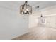 Dining room with wood flooring and modern chandelier at 839 S Westwood -- # 182, Mesa, AZ 85210