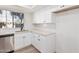 Modern white kitchen with stainless steel appliances and light wood flooring at 839 S Westwood -- # 182, Mesa, AZ 85210