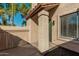 Front view of a charming stucco home with a green door and well-maintained landscaping at 839 S Westwood -- # 182, Mesa, AZ 85210