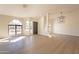 Bright dining room with arched windows and wood flooring at 19832 N 95Th Ave, Peoria, AZ 85382