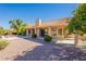 Landscaped backyard with a covered patio and view of the house at 19832 N 95Th Ave, Peoria, AZ 85382