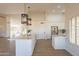 Open concept kitchen with white island and stainless steel appliances at 19832 N 95Th Ave, Peoria, AZ 85382