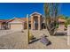 Single-story home with desert landscaping and two-car garage at 19832 N 95Th Ave, Peoria, AZ 85382