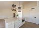 White kitchen island with marble countertop and built-in microwave at 19832 N 95Th Ave, Peoria, AZ 85382
