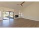 Living room with fireplace and sliding glass doors to patio at 19832 N 95Th Ave, Peoria, AZ 85382