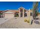 Single-story home with desert landscaping and two-car garage at 19832 N 95Th Ave, Peoria, AZ 85382