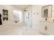 Modern bathroom with walk-in shower, marble tile, and floating vanity at 19832 N 95Th Ave, Peoria, AZ 85382