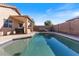 Inviting pool area with patio and built-in BBQ at 12243 W Dahlia Dr, El Mirage, AZ 85335