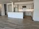 Spacious kitchen featuring granite countertops, modern cabinetry, and tile flooring at 16092 W Questa Dr, Surprise, AZ 85387