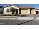 Two-car garage and attractive curb appeal at 16092 W Questa Dr, Surprise, AZ 85387