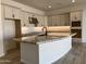 Modern kitchen with a large island and granite countertops at 16092 W Questa Dr, Surprise, AZ 85387