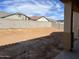 Large backyard with block wall and dirt at 16092 W Questa Dr, Surprise, AZ 85387
