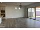 Bright dining room with tile floors and sliding glass door leading to the backyard at 16092 W Questa Dr, Surprise, AZ 85387