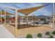 Community park with swings and shade sails at 16092 W Questa Dr, Surprise, AZ 85387