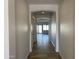 Bright and spacious hallway with tile flooring at 16092 W Questa Dr, Surprise, AZ 85387