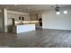 Open concept kitchen and dining area with tile flooring at 16092 W Questa Dr, Surprise, AZ 85387