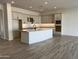 Spacious kitchen featuring granite countertops and modern cabinetry at 16092 W Questa Dr, Surprise, AZ 85387