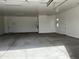 Large garage with double door entry and additional storage at 16092 W Questa Dr, Surprise, AZ 85387