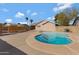 Inviting kidney-shaped pool in backyard at 951 E Halifax St, Mesa, AZ 85203