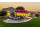 Relaxing backyard with pool, patio, and red umbrella at 1322 W Indigo Dr, Chandler, AZ 85248