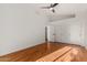 Spacious bedroom with hardwood floors and a ceiling fan at 1322 W Indigo Dr, Chandler, AZ 85248