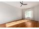 Bright bedroom with hardwood floors and a large window at 1322 W Indigo Dr, Chandler, AZ 85248