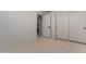 Bright bedroom with tile floors and double door closet at 1322 W Indigo Dr, Chandler, AZ 85248