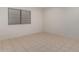 Simple bedroom with tile floors and ample closet space at 1322 W Indigo Dr, Chandler, AZ 85248
