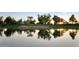 Golf course with a lake and beautiful sunset at 1322 W Indigo Dr, Chandler, AZ 85248