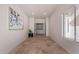Spacious hallway with tile flooring and modern wall art at 1322 W Indigo Dr, Chandler, AZ 85248