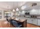 Modern kitchen with granite island and stainless steel appliances at 1322 W Indigo Dr, Chandler, AZ 85248