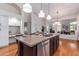 Kitchen with large island, hardwood floors, and stainless steel appliances at 1322 W Indigo Dr, Chandler, AZ 85248