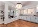Kitchen with white cabinets, granite countertops and breakfast bar at 1322 W Indigo Dr, Chandler, AZ 85248