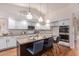 Spacious kitchen featuring granite countertops, stainless steel appliances, and an island at 1322 W Indigo Dr, Chandler, AZ 85248