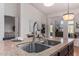 Modern double sink with a stylish faucet in a granite countertop at 1322 W Indigo Dr, Chandler, AZ 85248