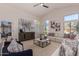 Living room with sectional sofa, large windows, and view to backyard at 1322 W Indigo Dr, Chandler, AZ 85248
