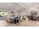 Open concept living and dining area with high ceilings and chandelier at 1322 W Indigo Dr, Chandler, AZ 85248