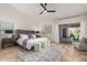 Large main bedroom with backyard access and a plush bed at 1322 W Indigo Dr, Chandler, AZ 85248