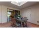 Covered patio with table and chairs, skylight at 1322 W Indigo Dr, Chandler, AZ 85248