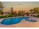 Inviting kidney shaped pool with spa and golf course view at 1322 W Indigo Dr, Chandler, AZ 85248