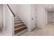 Modern staircase with wood steps and dark metal railing at 1322 W Indigo Dr, Chandler, AZ 85248