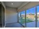 Covered patio with sliding glass doors and pool view at 2228 E Isaiah Ave, Gilbert, AZ 85298