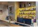 Home bar with extensive shelving, backlighting, and a stylish sink at 42383 N 111Th Pl, Scottsdale, AZ 85262