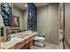 Unique bathroom with onyx sink and wine bottle wall at 42383 N 111Th Pl, Scottsdale, AZ 85262
