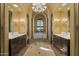 Spa-like bathroom with soaking tub, double vanities, and large windows at 42383 N 111Th Pl, Scottsdale, AZ 85262