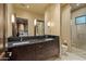 Modern bathroom with double vanity and a walk-in shower at 42383 N 111Th Pl, Scottsdale, AZ 85262