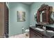 Powder room with a unique vanity and decorative mirror at 42383 N 111Th Pl, Scottsdale, AZ 85262