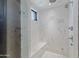 Large walk in shower with marble tile and built in bench at 42383 N 111Th Pl, Scottsdale, AZ 85262