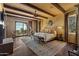 Bright Primary bedroom with mountain views, large bed, and hardwood floors at 42383 N 111Th Pl, Scottsdale, AZ 85262