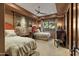 Guest bedroom with two twin beds and large tapestry at 42383 N 111Th Pl, Scottsdale, AZ 85262